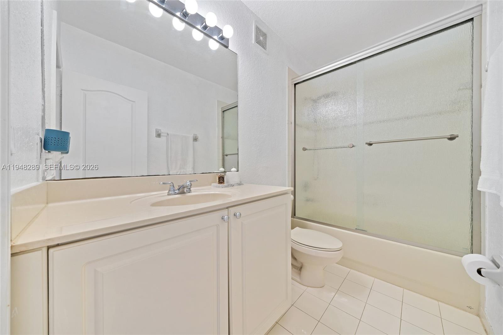 13770 Southwest 170th Lane Miami, FL 33177 - Photo 22 of 24 a bathroom with a sink a toilet and shower