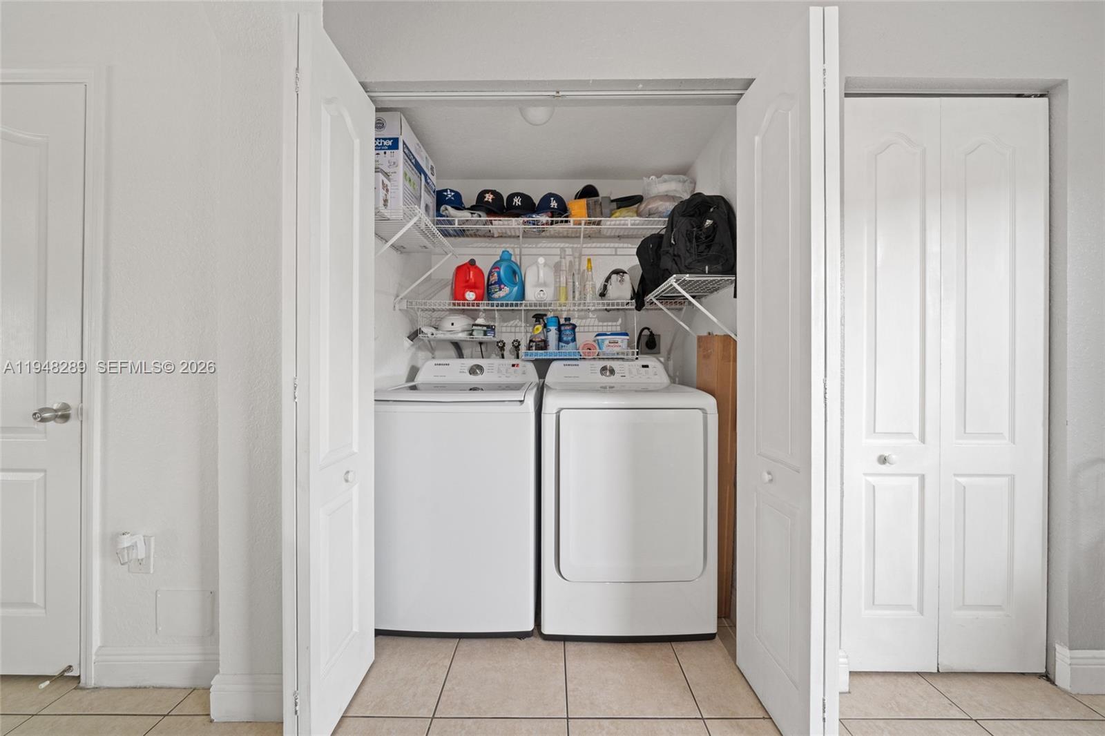 13770 Southwest 170th Lane Miami, FL 33177 - Photo 23 of 24 a view of storage and utility room with washer and dryer
