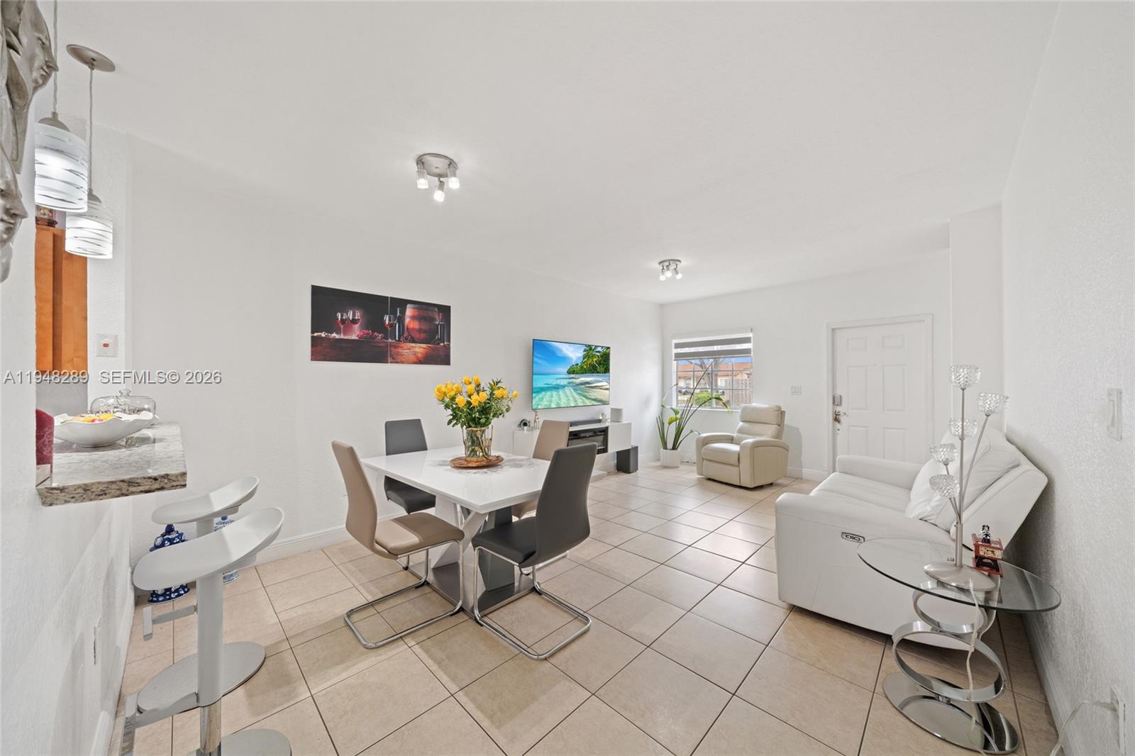 13770 Southwest 170th Lane Miami, FL 33177 - Photo 5 of 24 a living room with furniture and a window
