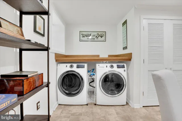 a utility room with dryer and washer