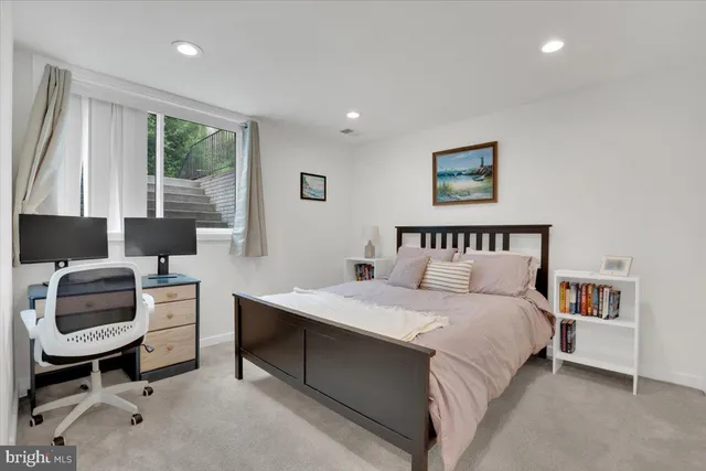 a bedroom with a bed and a chair