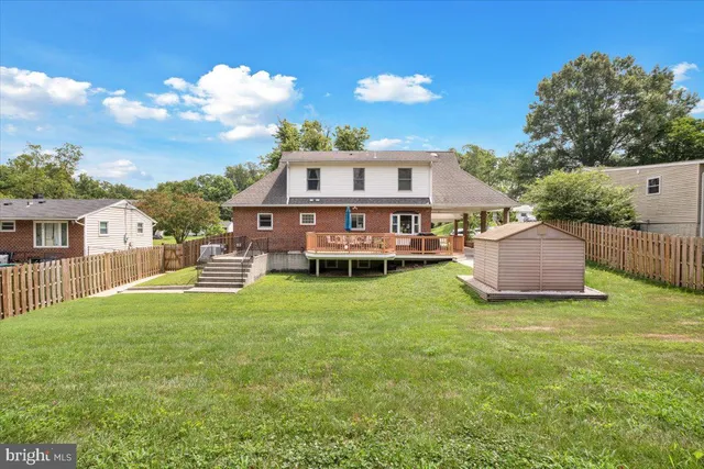 a front view of a house with a garden and plants