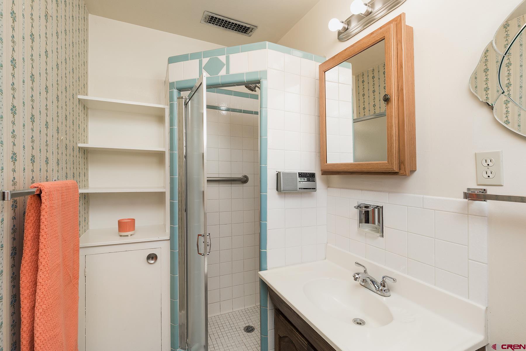 164 Riverview Drive Durango, CO 81301 - Photo 14 of 32 a bathroom with a sink and a mirror