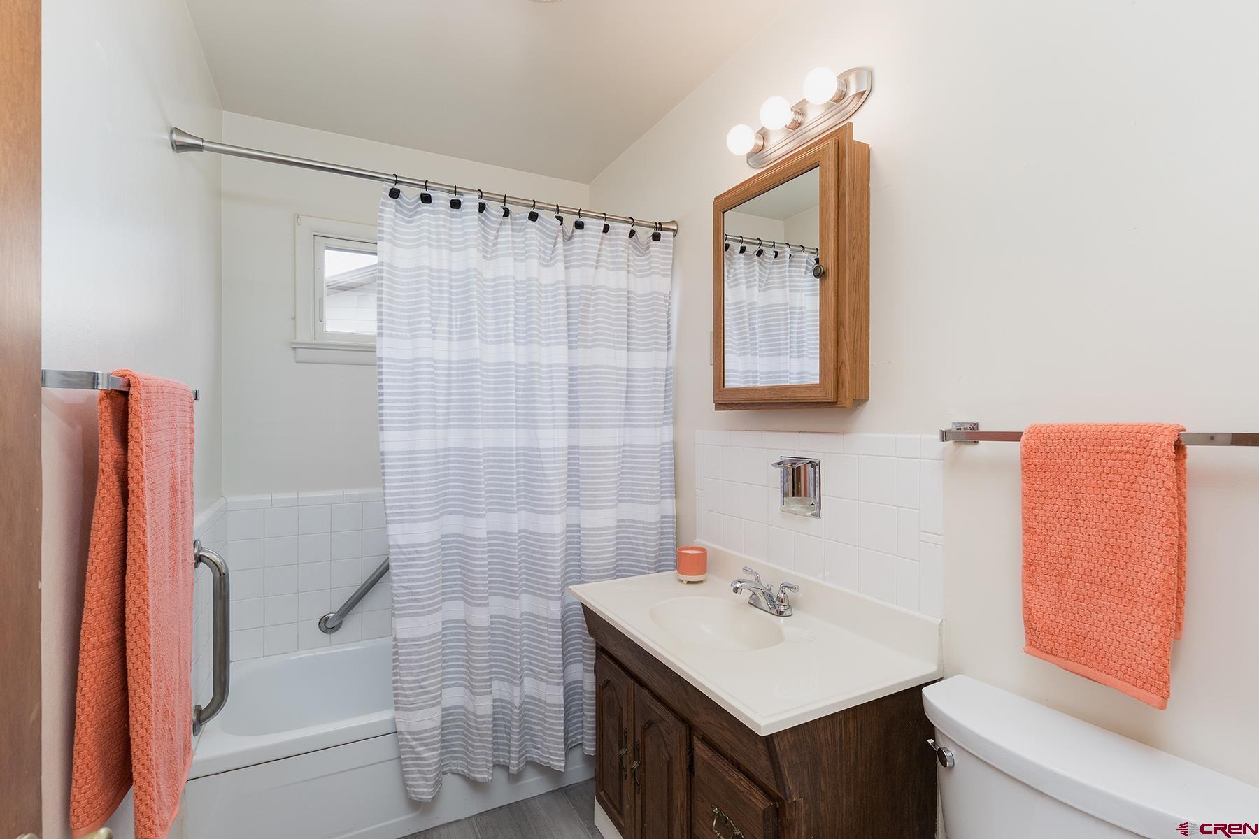 164 Riverview Drive Durango, CO 81301 - Photo 16 of 32 a bathroom with a sink toilet and shower