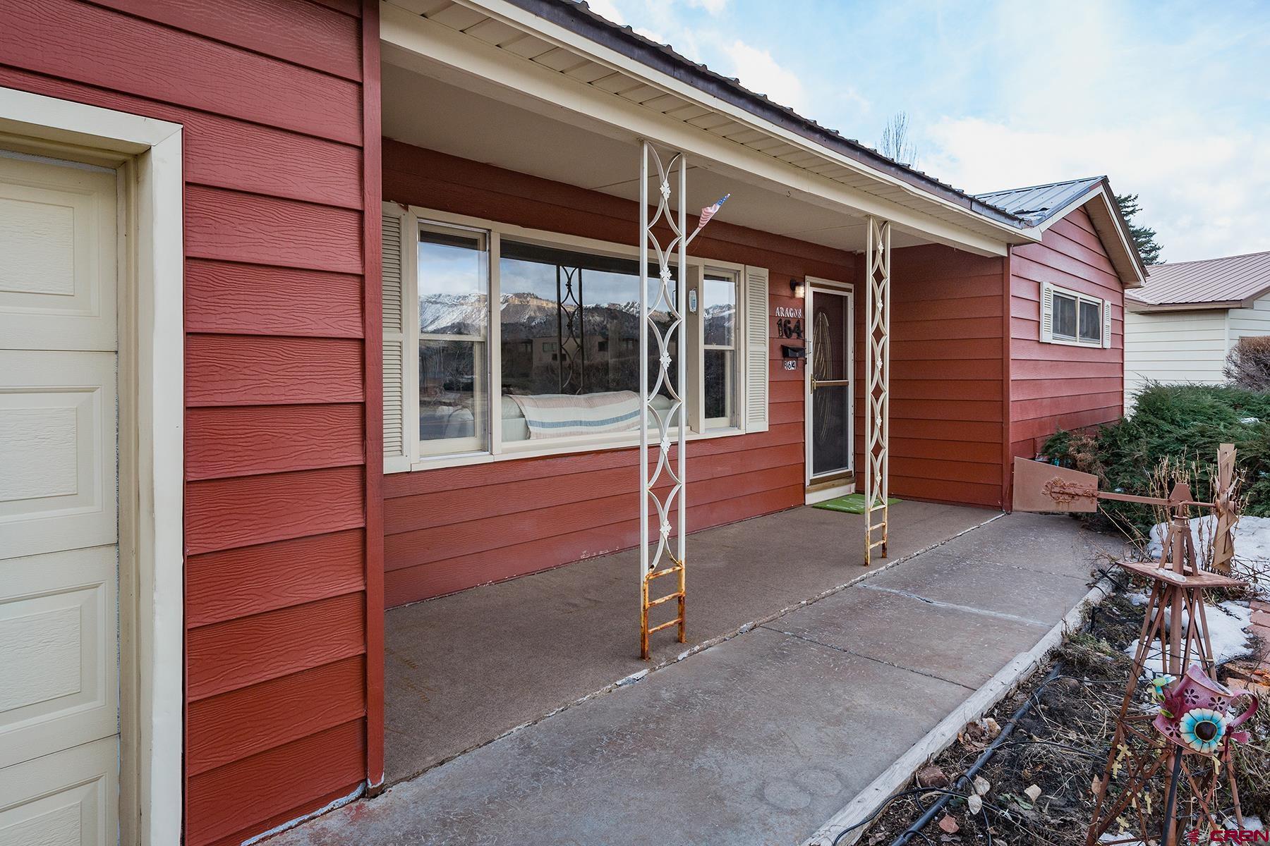 164 Riverview Drive Durango, CO 81301 - Photo 26 of 32 front view of a house with a porch