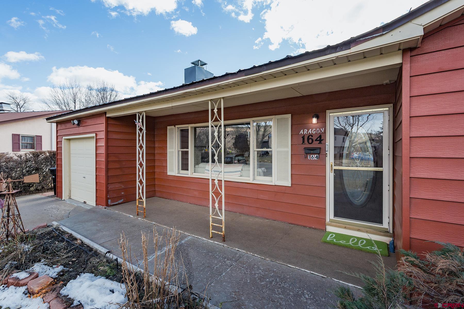 164 Riverview Drive Durango, CO 81301 - Photo 27 of 32 a view of house with backyard and porch