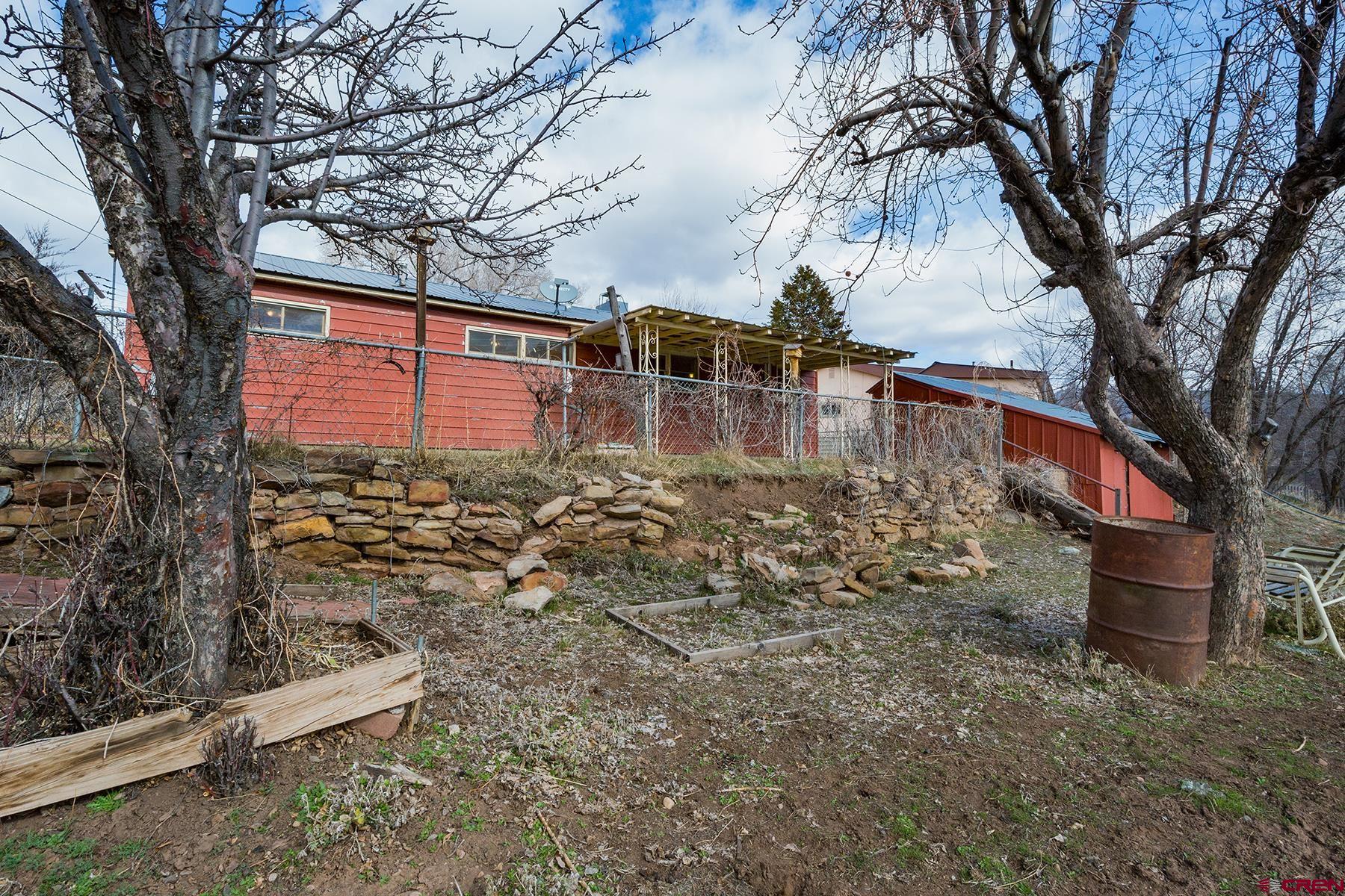 164 Riverview Drive Durango, CO 81301 - Photo 29 of 32 a view of a yard with large trees