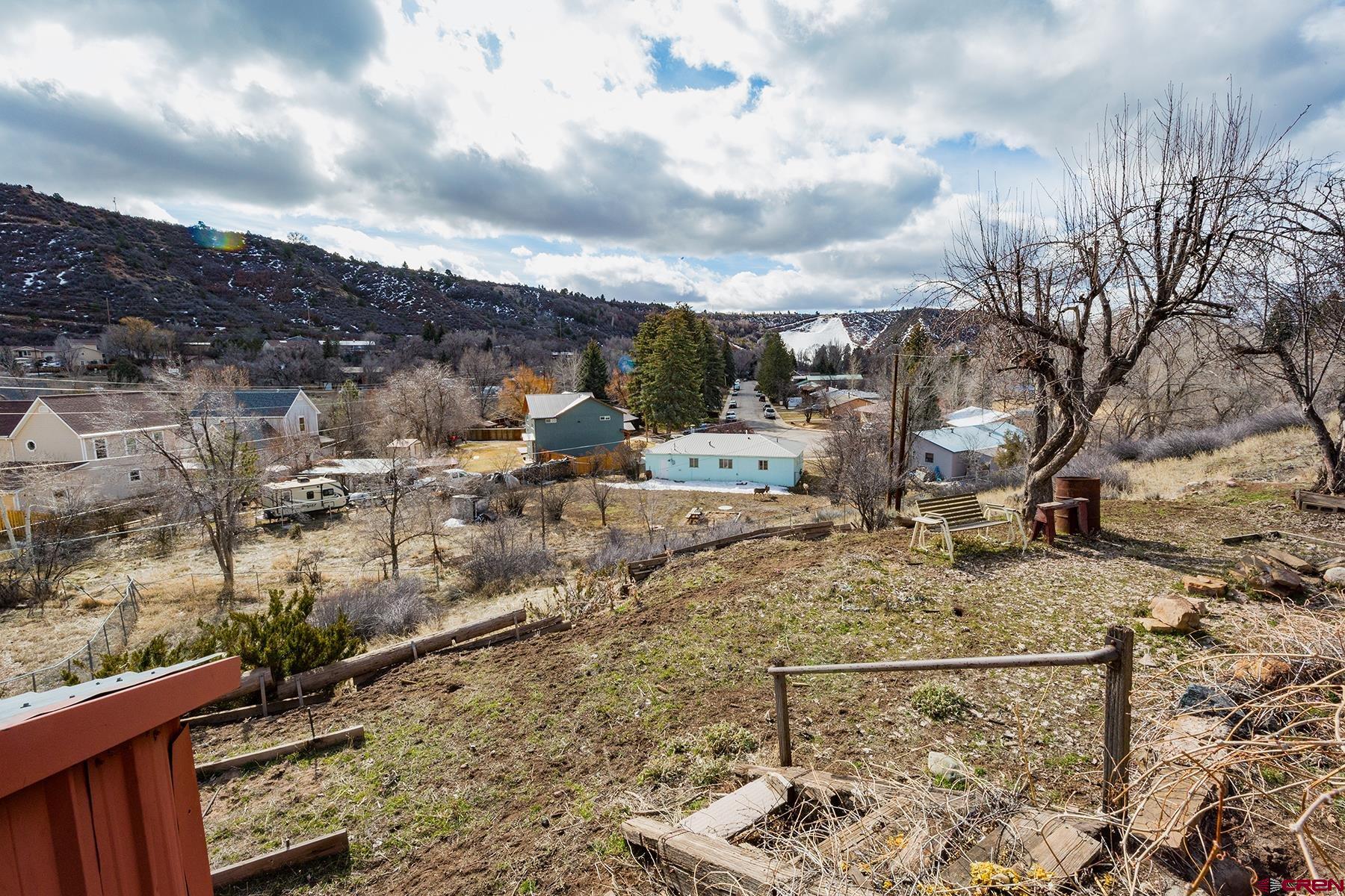 164 Riverview Drive Durango, CO 81301 - Photo 30 of 32 a view of a dry yard with wooden fence