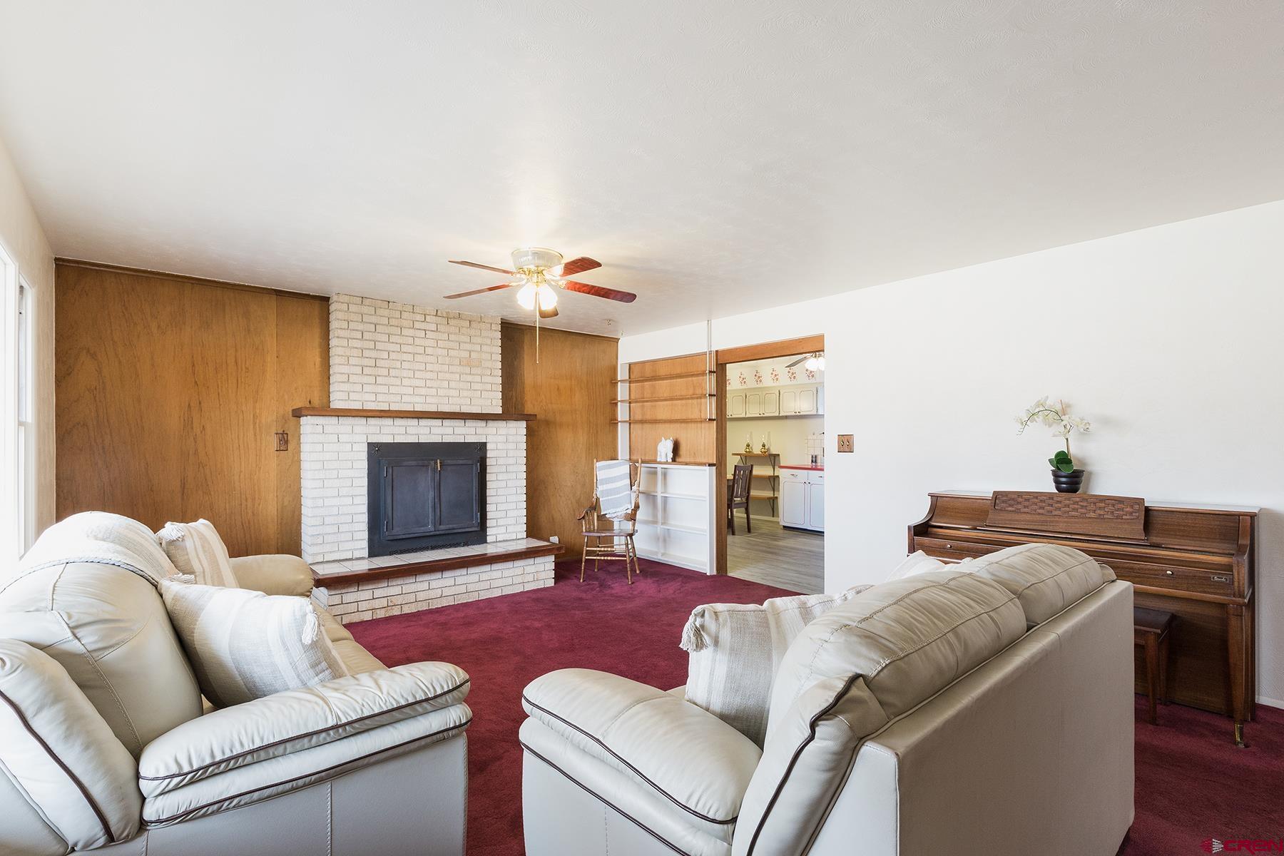 164 Riverview Drive Durango, CO 81301 - Photo 5 of 32 a living room with furniture and a fireplace