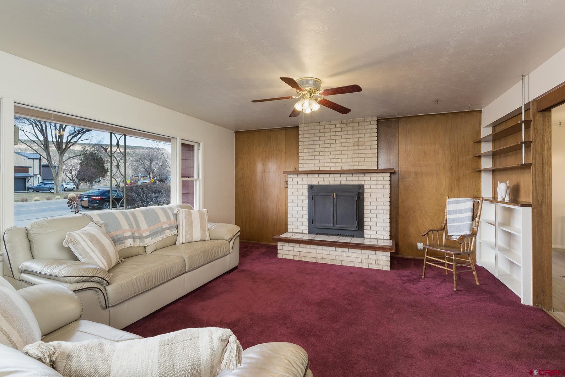 164 Riverview Drive Durango, CO 81301 - Photo 7 of 32 a living room with furniture and a fireplace