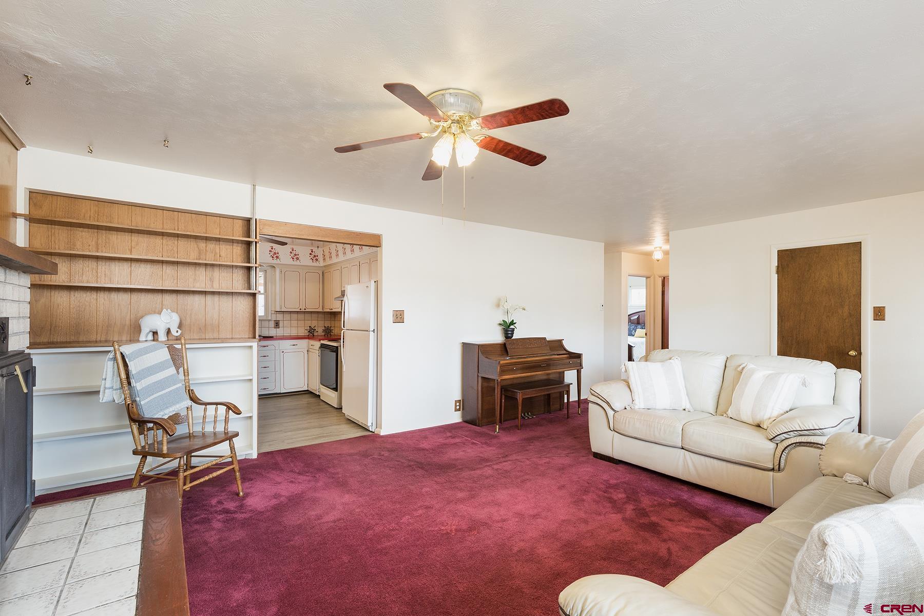 164 Riverview Drive Durango, CO 81301 - Photo 8 of 32 a living room with furniture and a ceiling fan