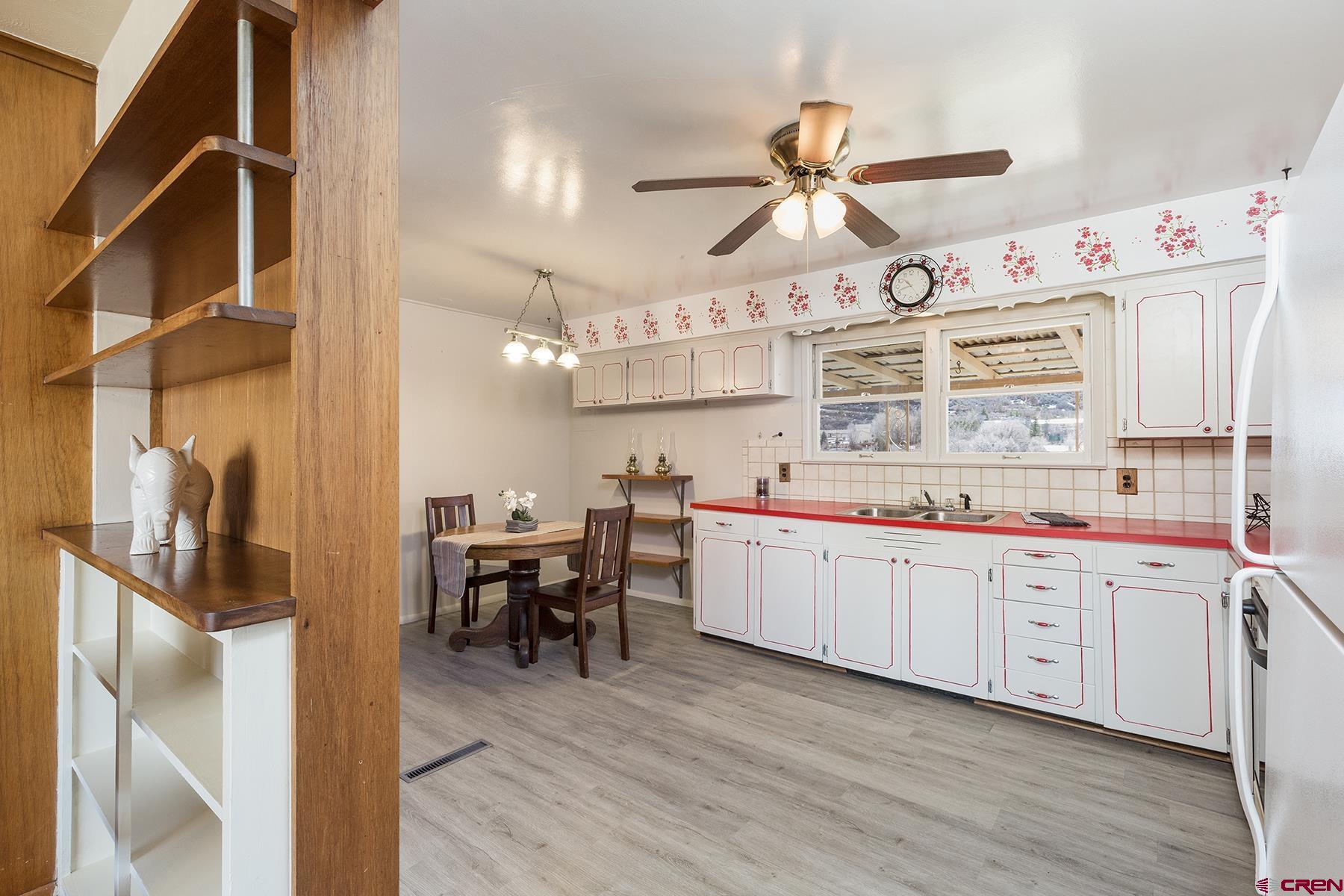 164 Riverview Drive Durango, CO 81301 - Photo 9 of 32 a kitchen with cabinets a sink and appliances