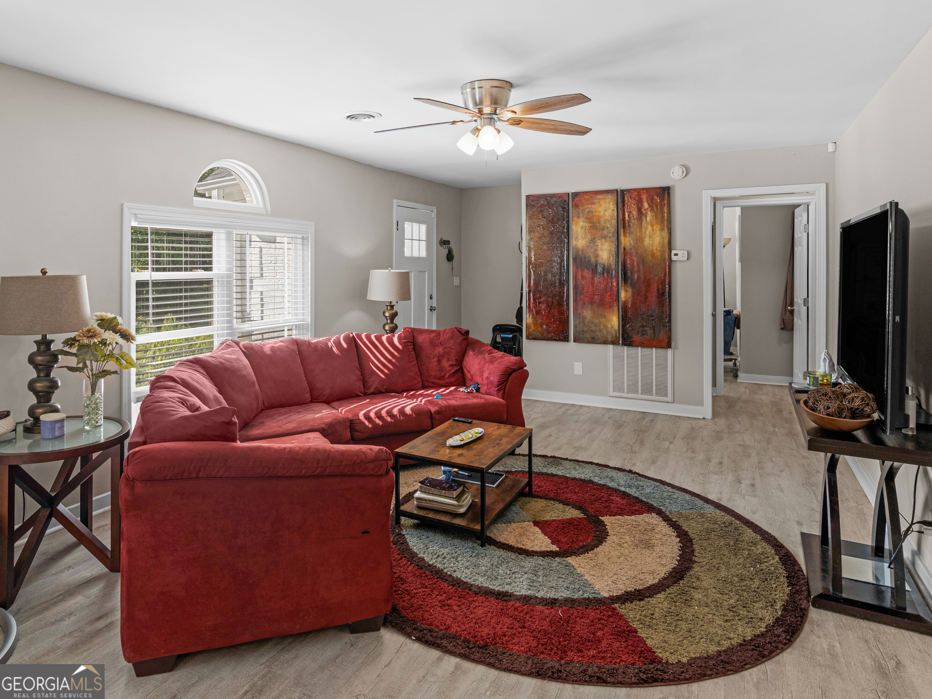 3445 Travis Boulevard Macon, GA 31206 - Photo 2 of 20 a living room with furniture and a flat screen tv