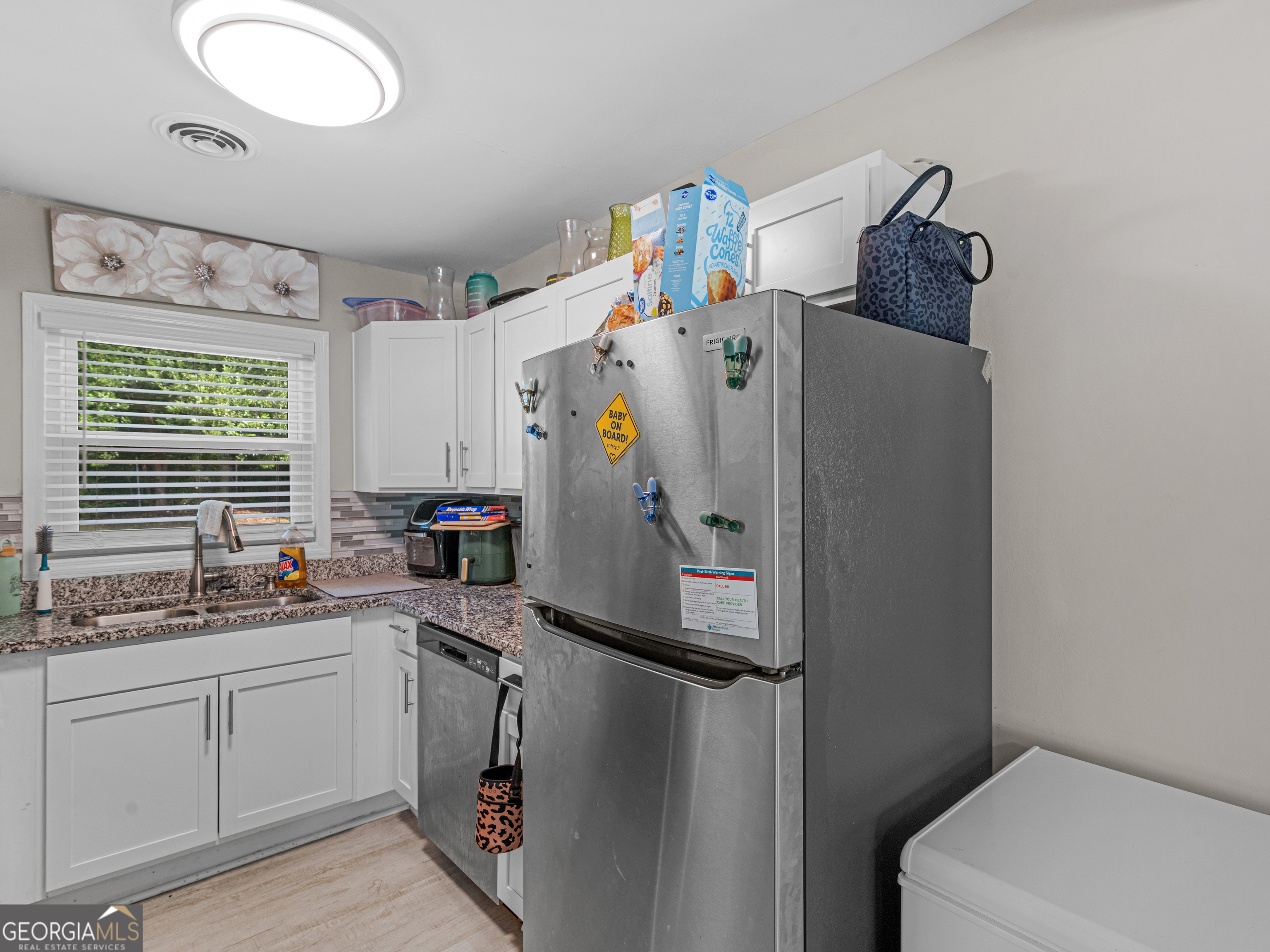 3445 Travis Boulevard Macon, GA 31206 - Photo 6 of 20 a white refrigerator freezer sitting inside of a kitchen