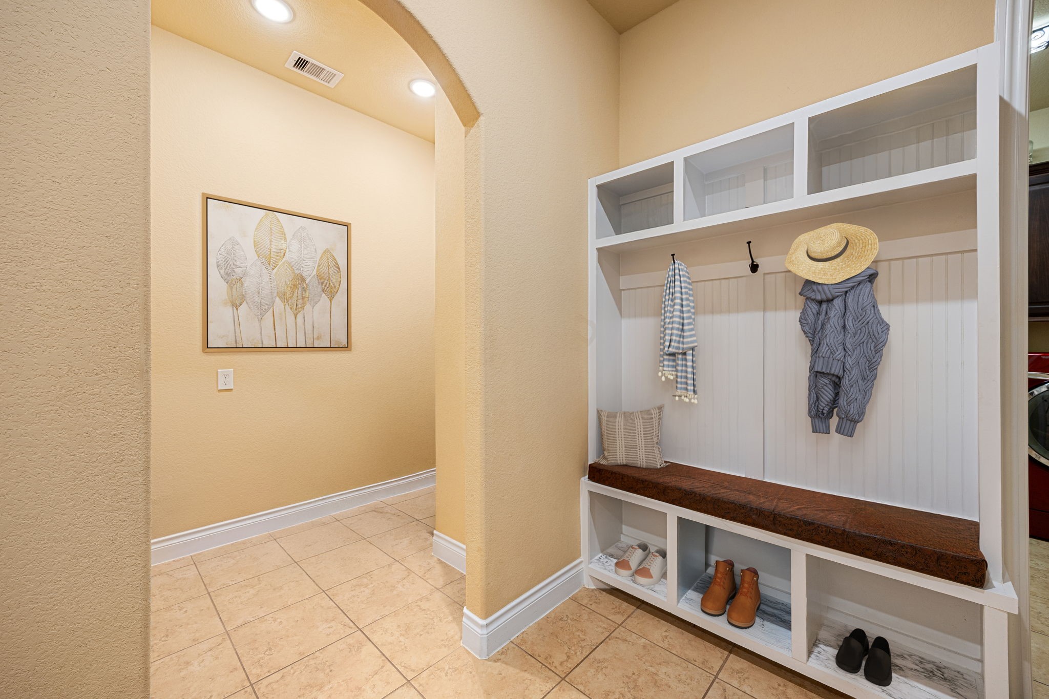 23421 Cannondale Loop Montgomery, TX 77316 - Photo 15 of 47 Charming and functional mudroom area featuring built-in cubbies, bench seating, and open storage—perfect for keeping coats, shoes, and everyday essentials organized while adding a welcoming touch just off the entryway.