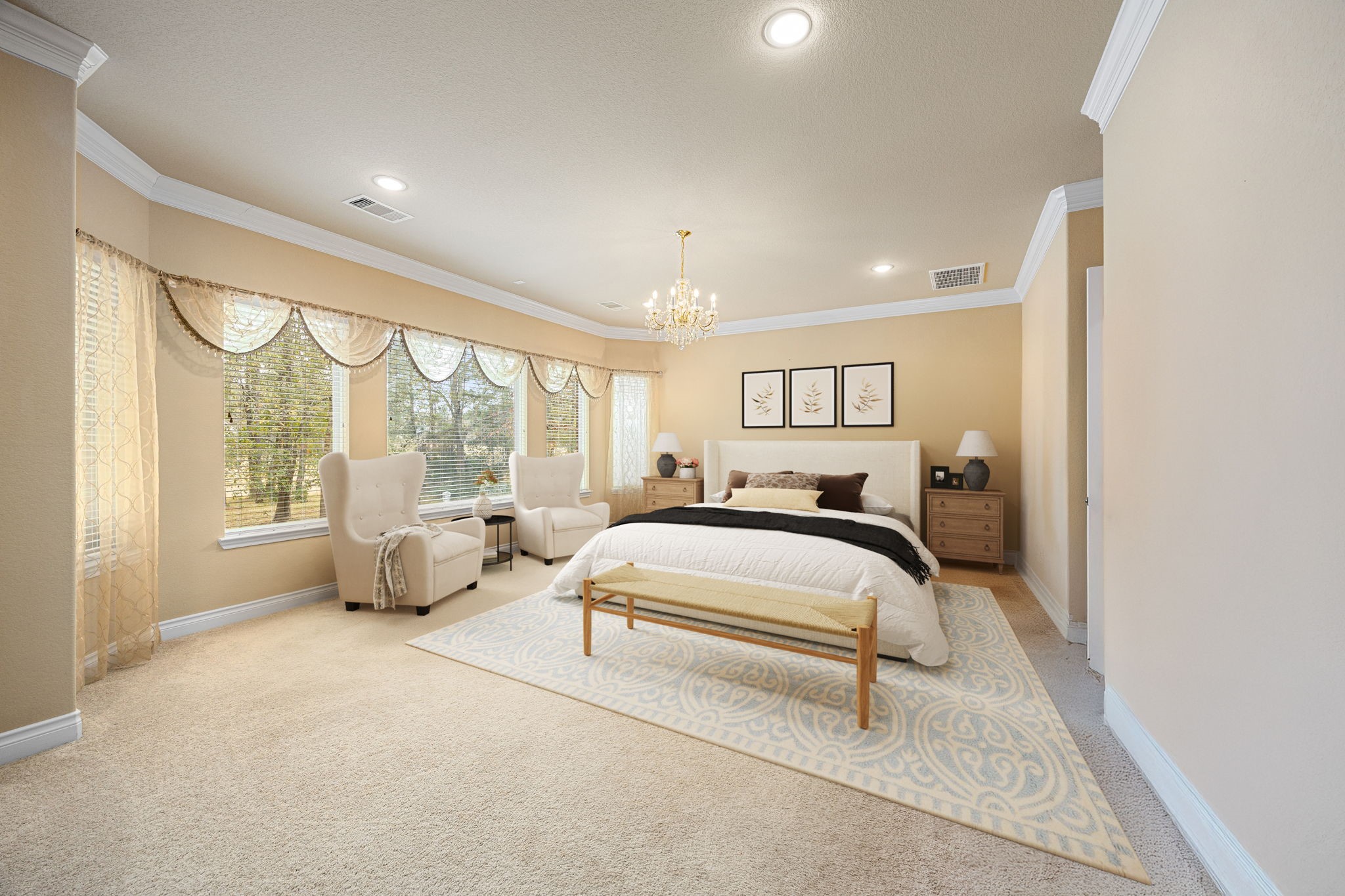 23421 Cannondale Loop Montgomery, TX 77316 - Photo 16 of 47 Spacious and serene primary bedroom retreat featuring plush carpet, elegant crown molding, and abundant natural light from large windows. A cozy sitting area, chandelier accent, and soft neutral palette create a relaxing, hotel-like atmosphere—perfect for unwinding at the end of the day