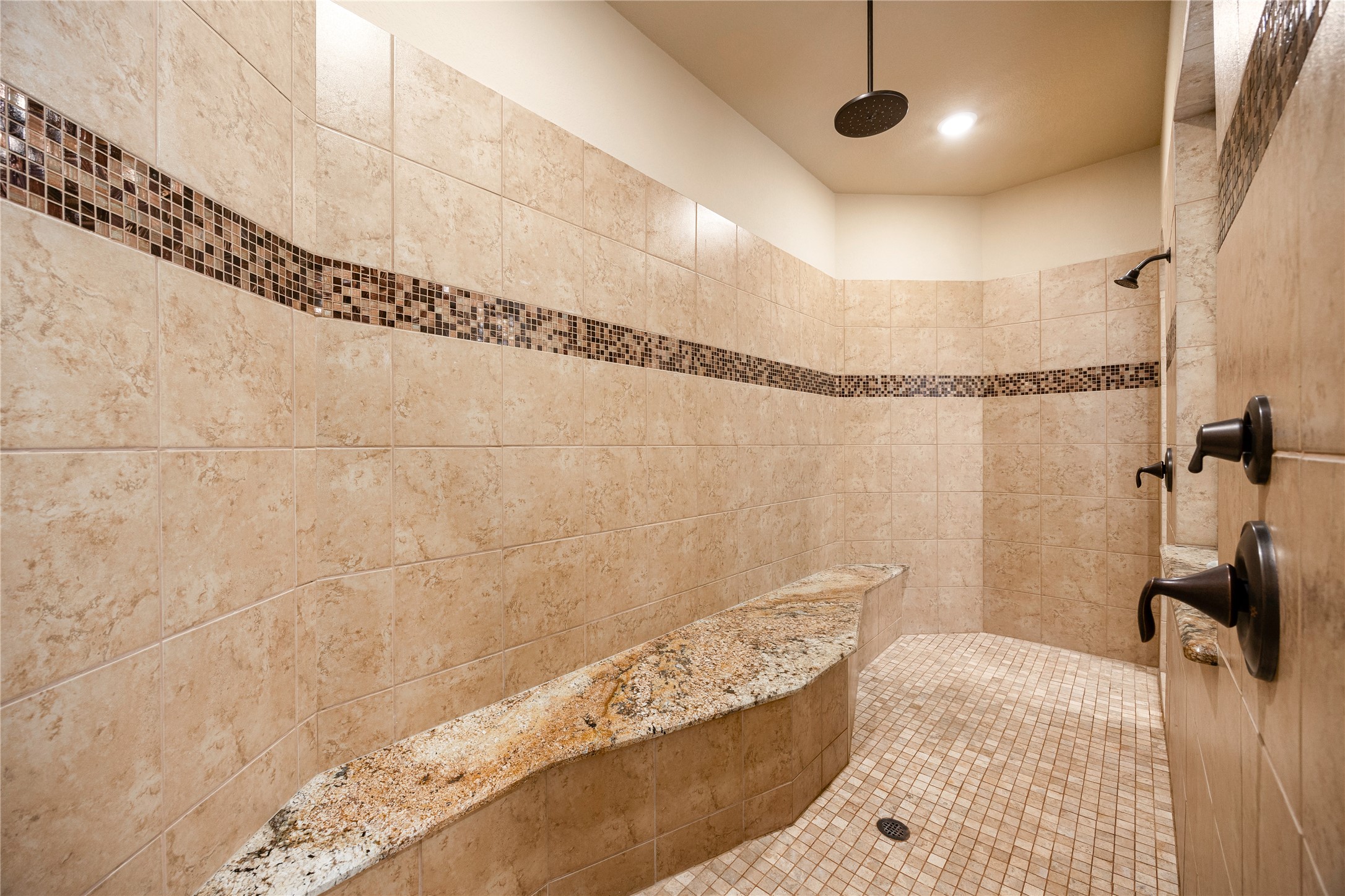 23421 Cannondale Loop Montgomery, TX 77316 - Photo 21 of 47 A spacious dual-entry shower with bench, rain shower head, and two wall sprayers.