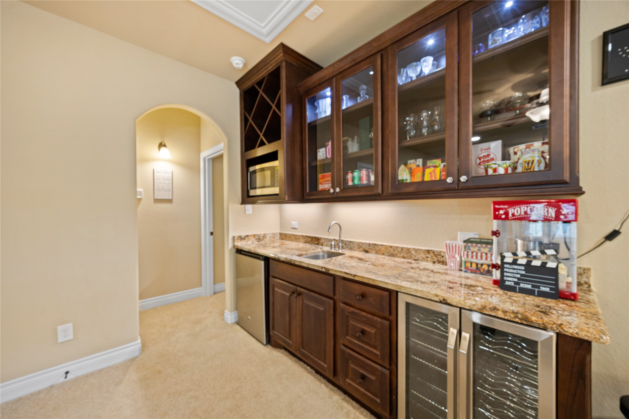 23421 Cannondale Loop Montgomery, TX 77316 - Photo 24 of 47 This kitchenette in the gameroom is the perfect way to entertain! Make popcorn for the theater room, store beveredges in the two mini-refridgerators, and a sink for easy cleanup.