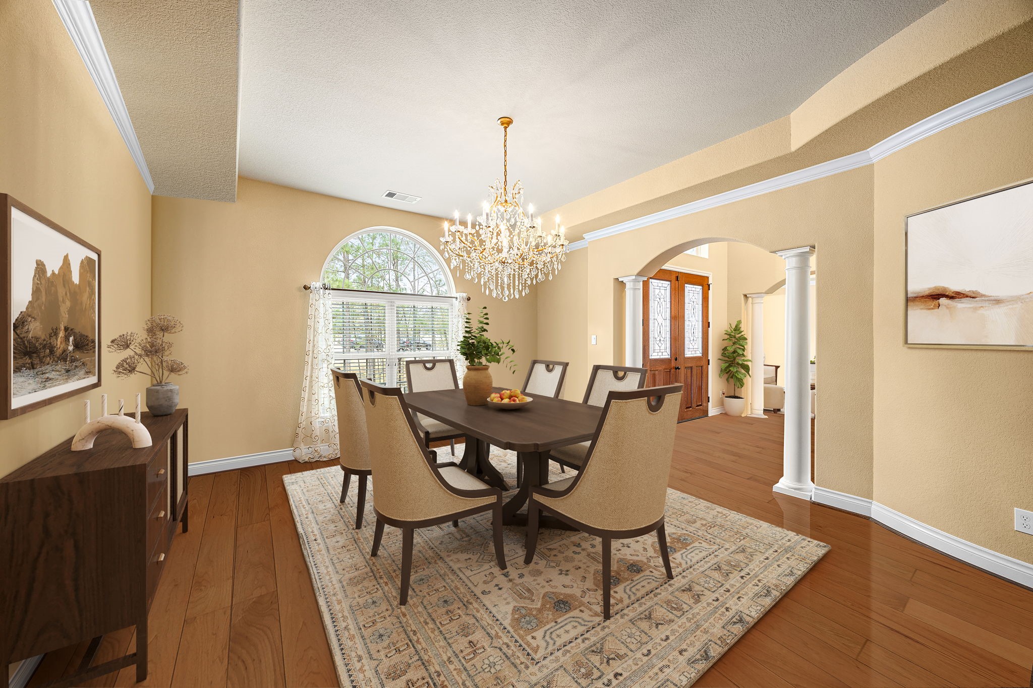 23421 Cannondale Loop Montgomery, TX 77316 - Photo 7 of 47 Elegant formal dining room showcasing rich hardwood floors, crown molding, and a stunning chandelier that adds a touch of timeless sophistication. An arched window fills the space with natural light, while the open flow to the foyer creates a perfect setting for hosting memorable dinners and special gatherings.