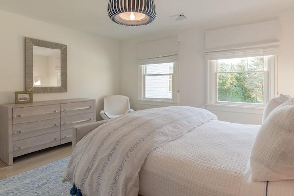 520 Hampton Road, Unit 18 Southampton, NY 11968 - Photo 11 of 20 a bedroom with a bed and a dresser
