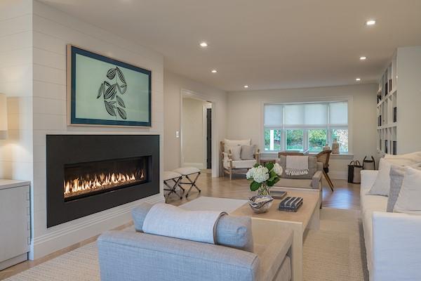 520 Hampton Road, Unit 18 Southampton, NY 11968 - Photo 2 of 20 a living room with furniture a fireplace and a large window