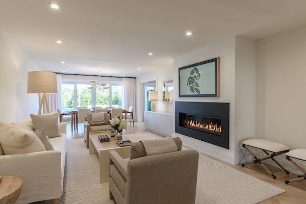 520 Hampton Road, Unit 18 Southampton, NY 11968 - Photo 3 of 20 a living room with furniture and a fireplace