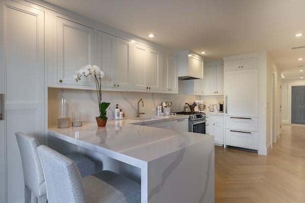 520 Hampton Road, Unit 18 Southampton, NY 11968 - Photo 5 of 20 a kitchen with white cabinets and counter