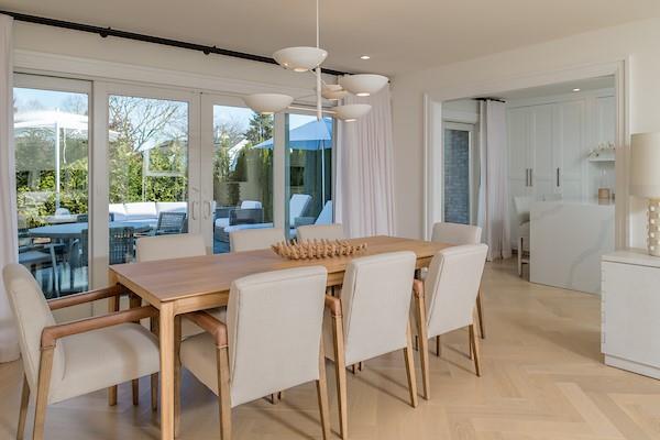 520 Hampton Road, Unit 18 Southampton, NY 11968 - Photo 6 of 20 a view of a dining room with furniture window and outside view
