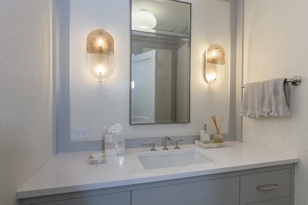 520 Hampton Road, Unit 18 Southampton, NY 11968 - Photo 7 of 20 a bathroom with double vanity sinks and a mirror