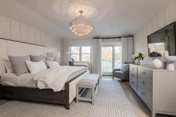 520 Hampton Road, Unit 18 Southampton, NY 11968 - Photo 9 of 20 a bedroom with bed and window