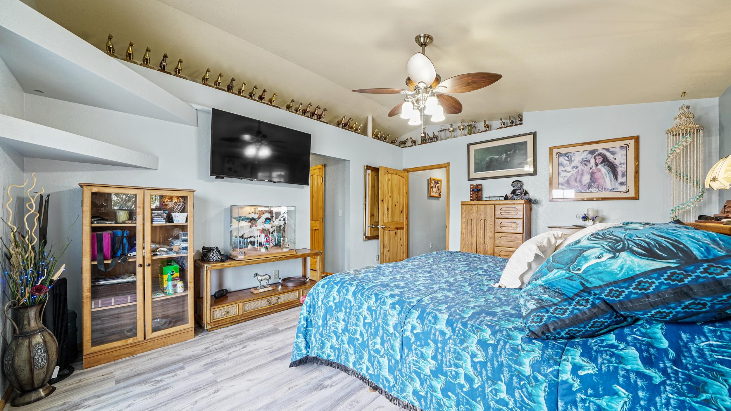 20786 Iris Road Austin, CO 81410 - Photo 20 of 38 a bedroom with a bed and a flat screen tv