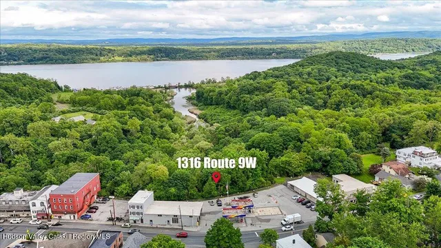 a view of a lake with houses in the back