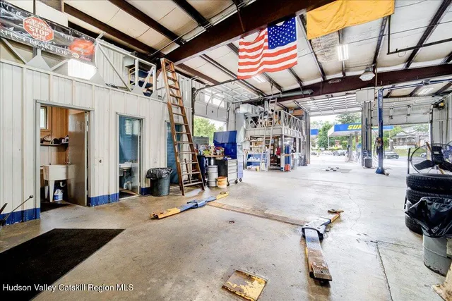 a room with gym equipment and a large window