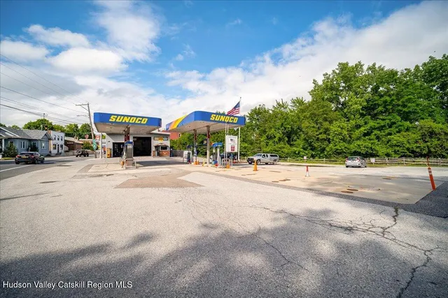 a view of building with car parked