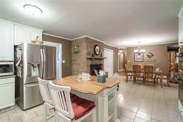 a dining room with furniture and a fireplace