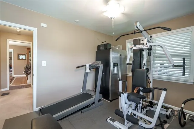 a balcony with wooden floor and fence