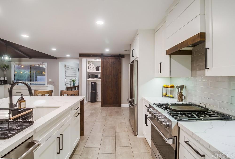 2444 Via Dieguenos Alpine, CA 91901 - Photo 13 of 69 a kitchen with a stove a sink and a refrigerator