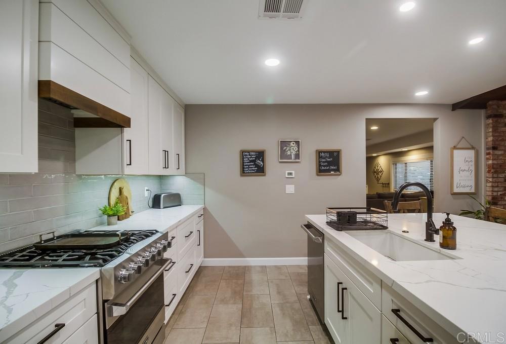 2444 Via Dieguenos Alpine, CA 91901 - Photo 16 of 69 a kitchen with stainless steel appliances a sink stove and cabinets