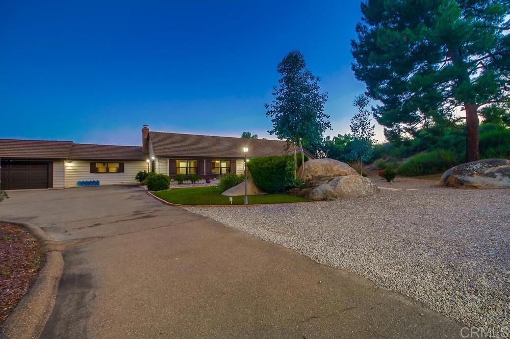 2444 Via Dieguenos Alpine, CA 91901 - Photo 2 of 69 a front view of a house with a yard and garage