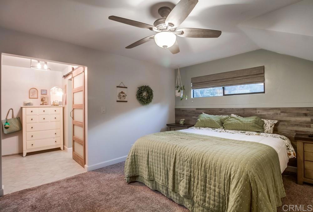 2444 Via Dieguenos Alpine, CA 91901 - Photo 25 of 69 a bedroom with a large bed and a ceiling fan
