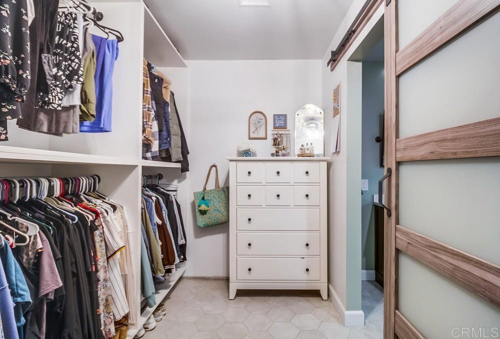 2444 Via Dieguenos Alpine, CA 91901 - Photo 30 of 69 a view of walk in closet with clothes and shoes