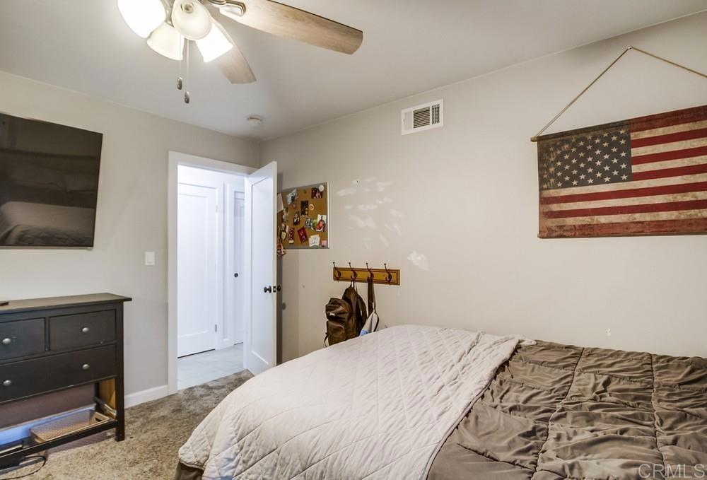 2444 Via Dieguenos Alpine, CA 91901 - Photo 31 of 69 a bedroom with a bed and a flat screen tv