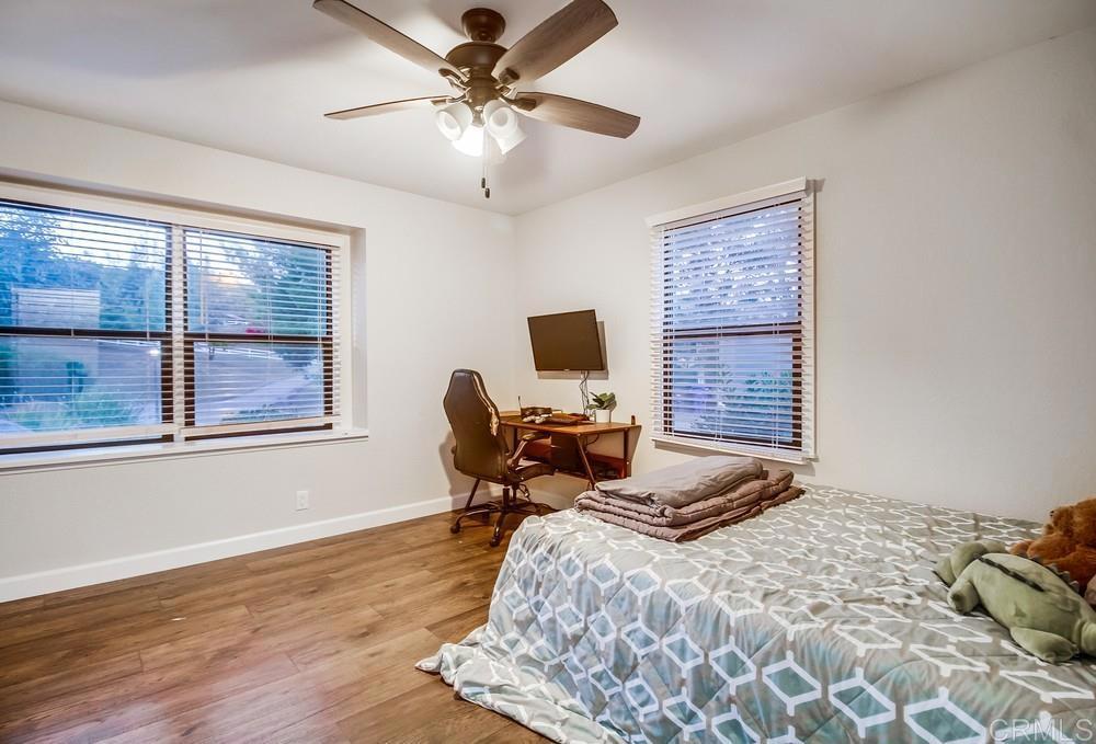 2444 Via Dieguenos Alpine, CA 91901 - Photo 33 of 69 a bedroom with a bed furniture and two window