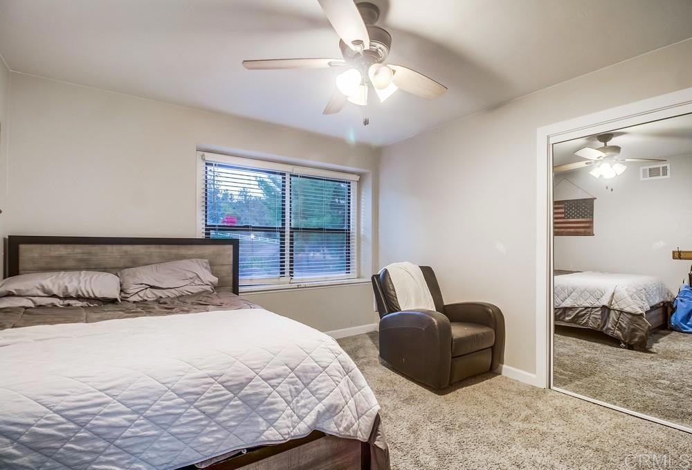 2444 Via Dieguenos Alpine, CA 91901 - Photo 34 of 69 a bedroom with a bed and glass chair