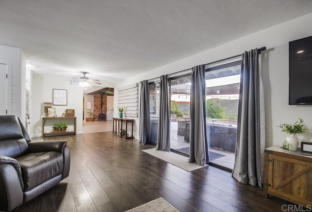 2444 Via Dieguenos Alpine, CA 91901 - Photo 4 of 69 a living room with furniture and a flat screen tv