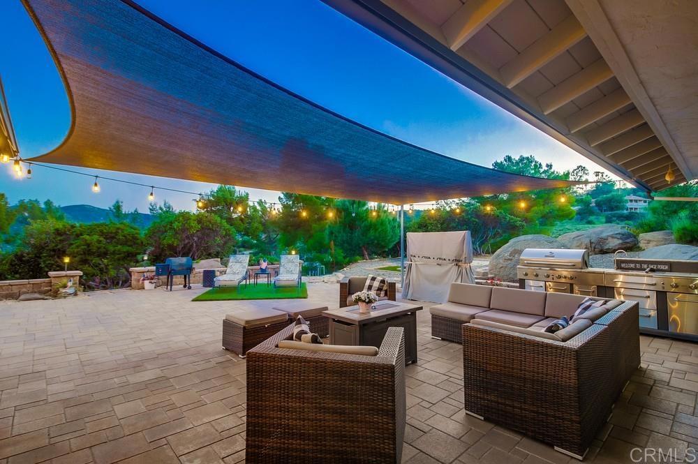 2444 Via Dieguenos Alpine, CA 91901 - Photo 43 of 69 a view of a patio with table and chairs and a barbeque