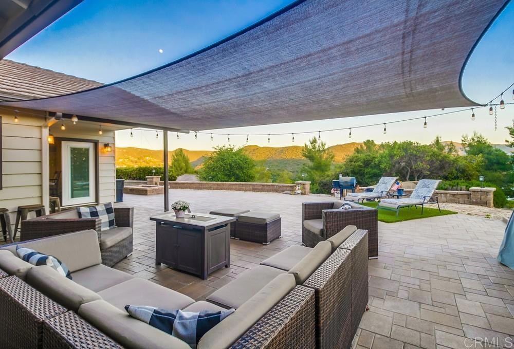 2444 Via Dieguenos Alpine, CA 91901 - Photo 52 of 69 a living room with patio furniture and a floor to ceiling window