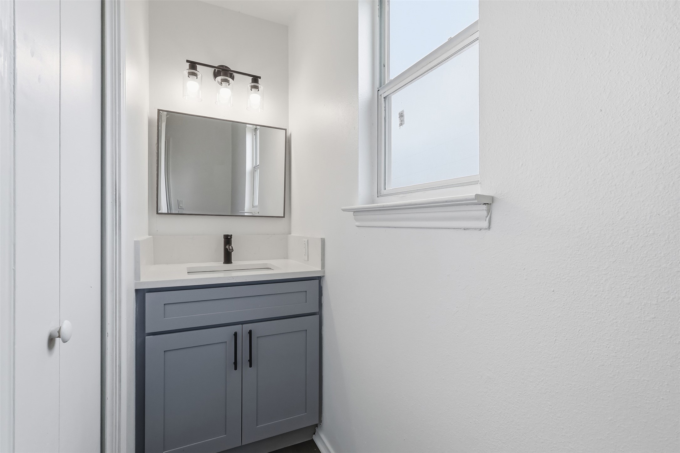 13201 Jacobson Road Manor, TX 78653 - Photo 12 of 25 a bathroom with 2 sink and a mirror
