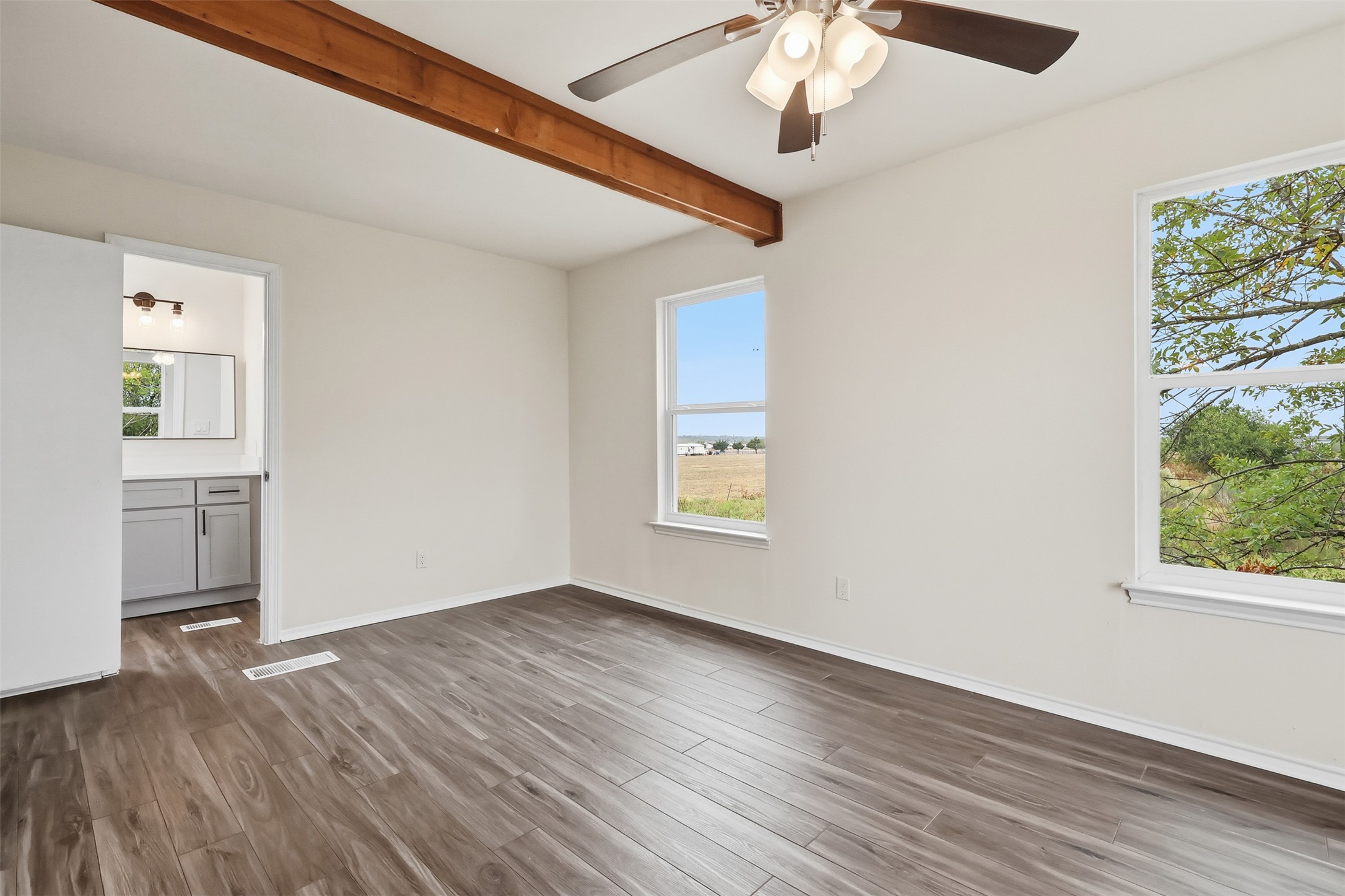 13201 Jacobson Road Manor, TX 78653 - Photo 17 of 25 wooden floor in an empty room with a window