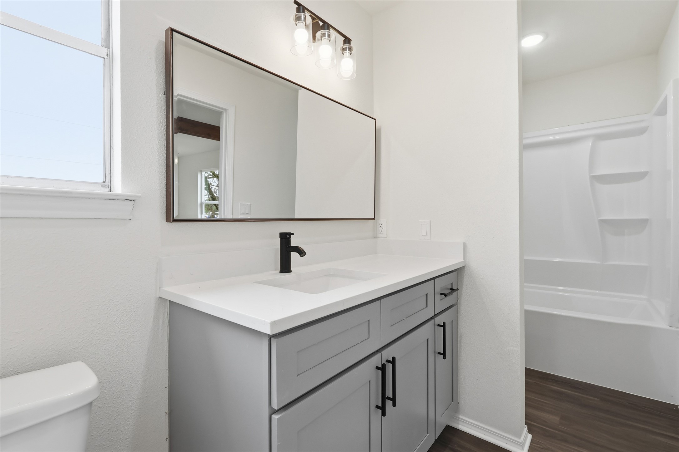 13201 Jacobson Road Manor, TX 78653 - Photo 21 of 25 a bathroom with a sink and a toilet